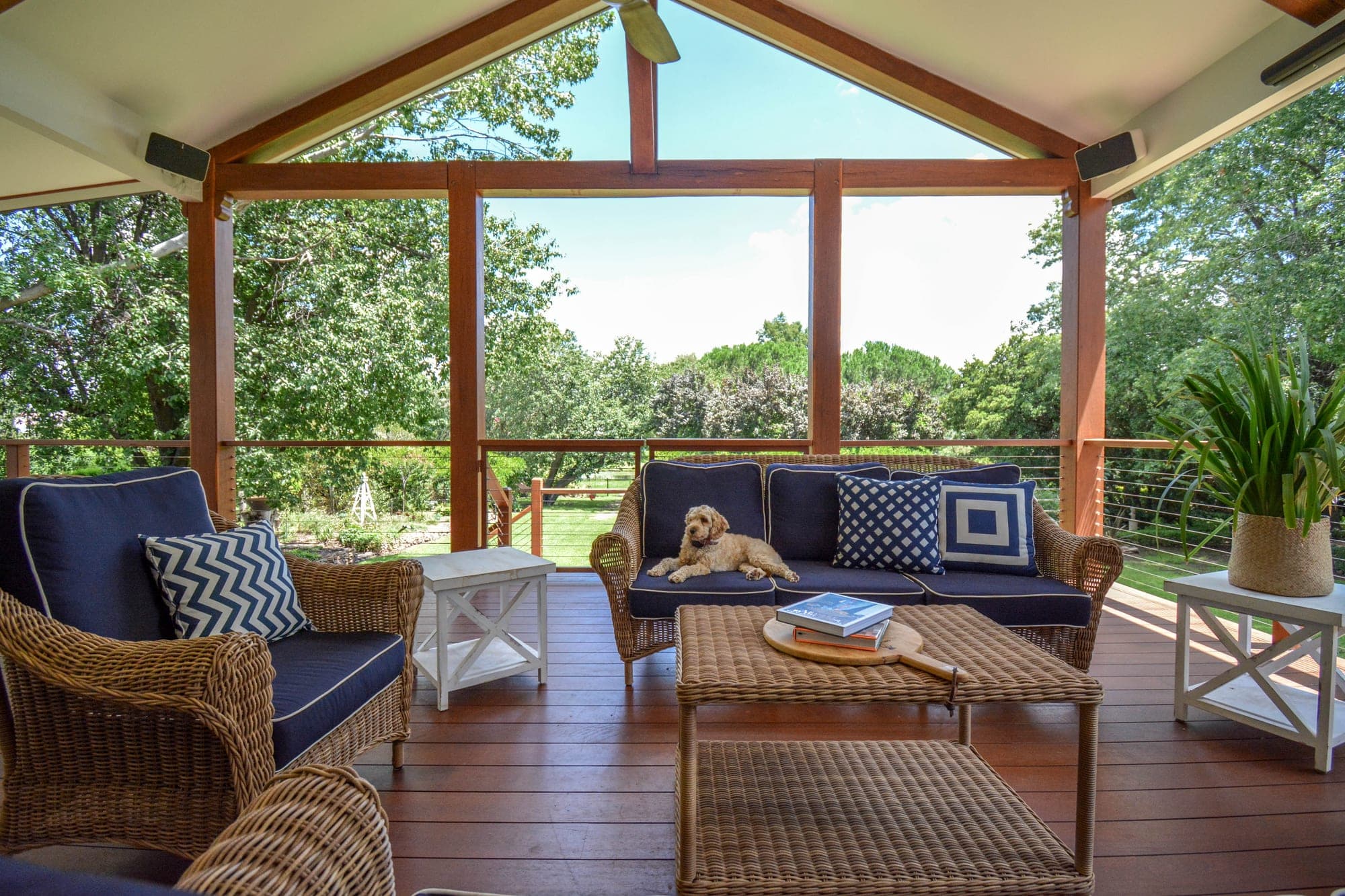 Covered outdoor deck with timber frame, wicker furniture and garden views, Wahroonga Granite Belt