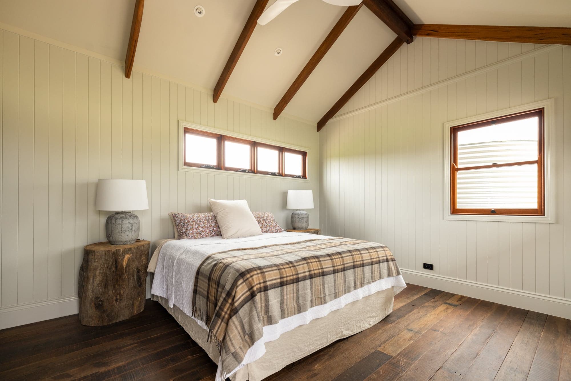 Mountain Station property panorama — homestead set among native trees with open rural paddocks beyond