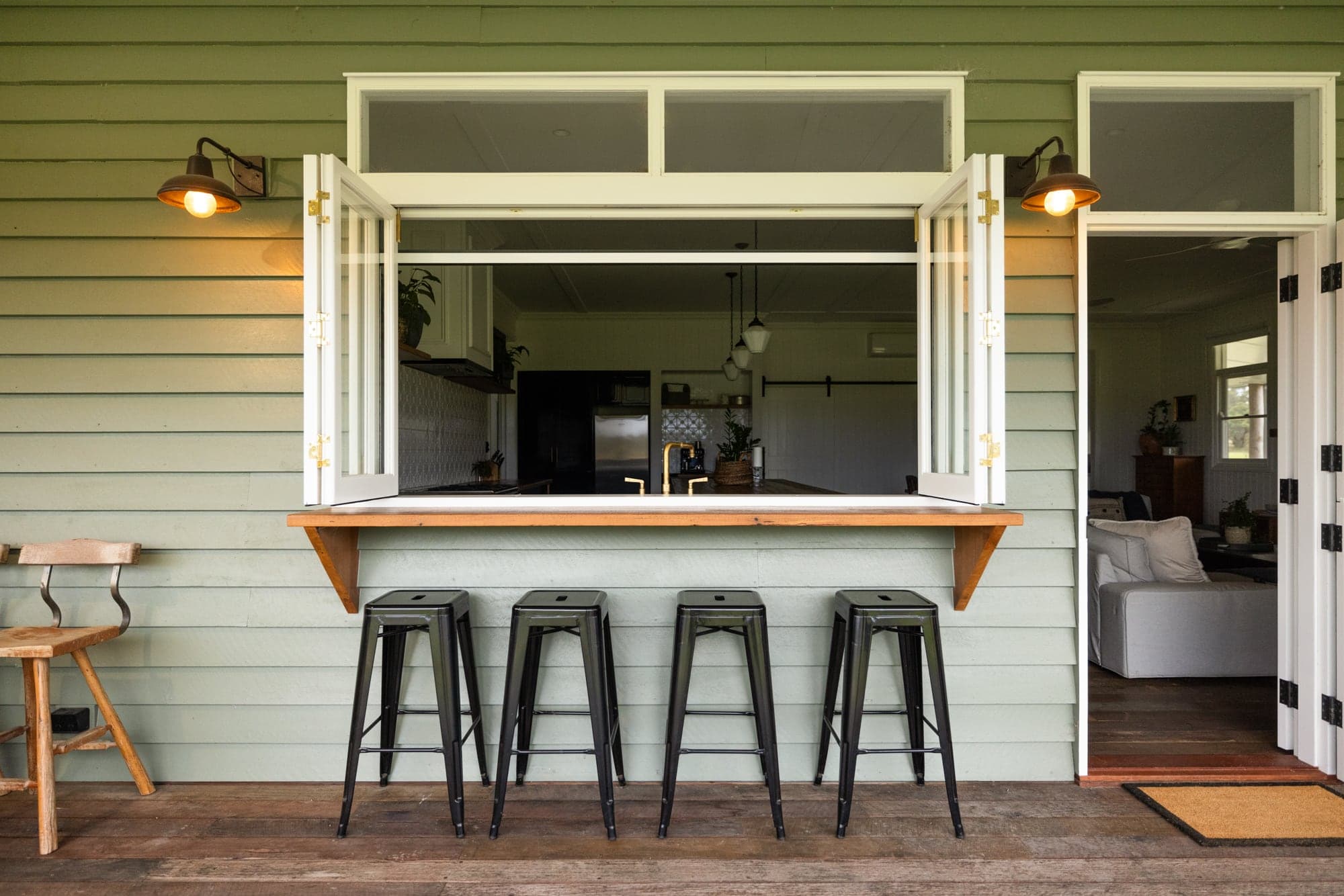 Mountain Station outdoor area with timber decking and rural property views at golden hour
